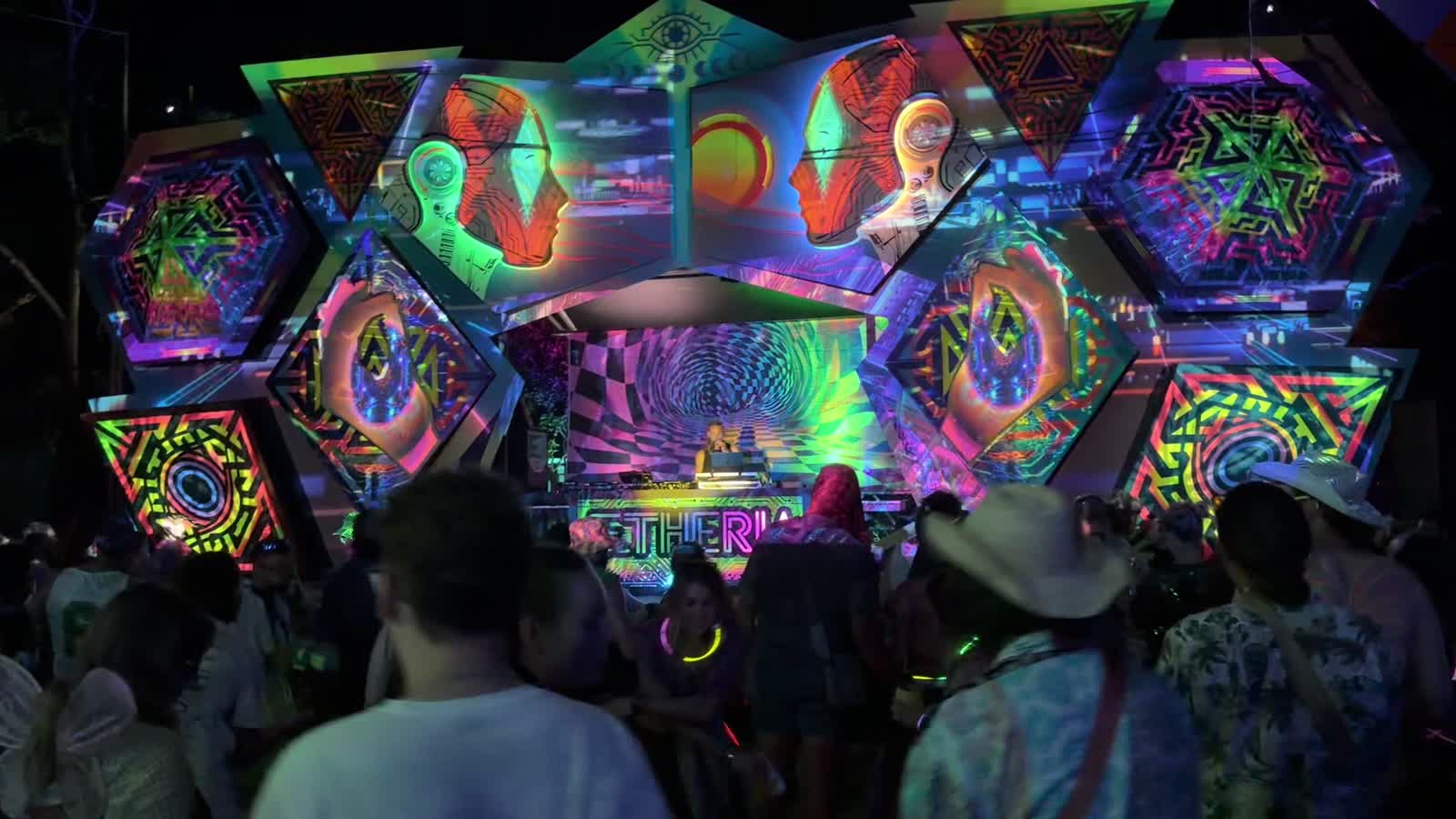 The Aetheria dancefloor beneath a stage alive with psychedelic projections